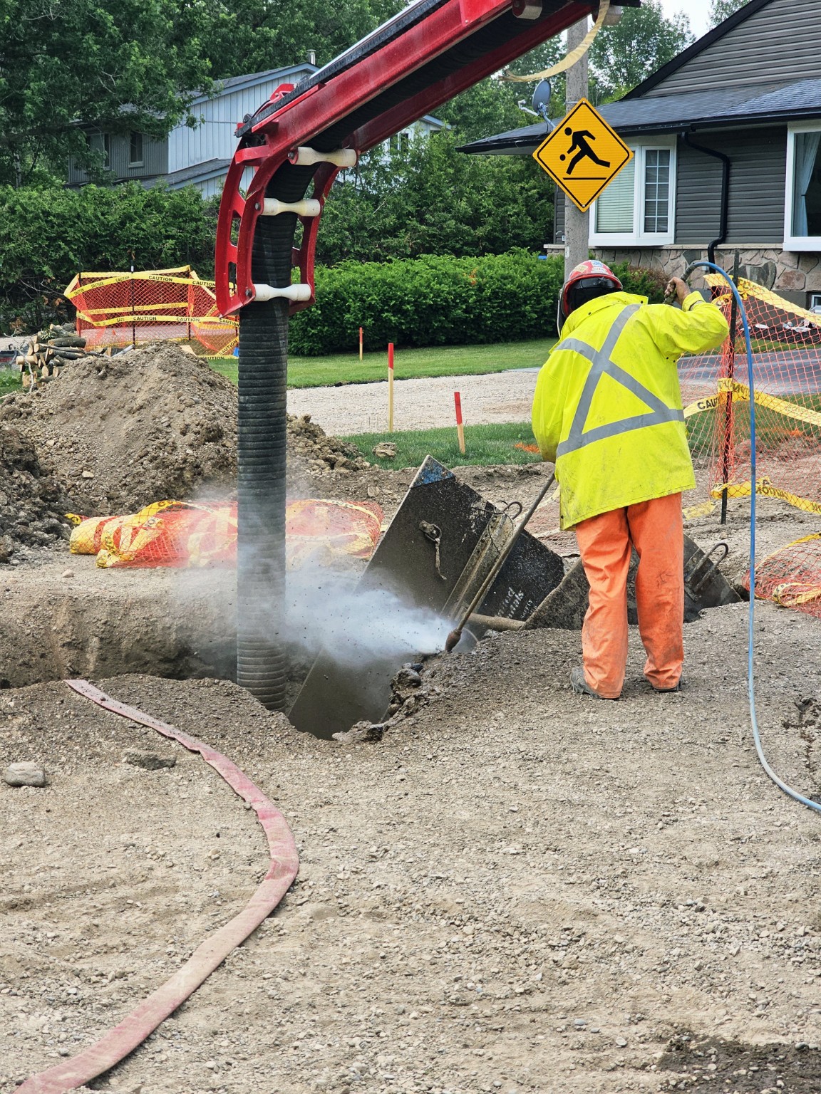 Hydrovac excavation activity documented in an active utility work area